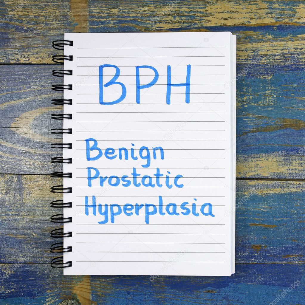 BPH- Benign Prostatic Hyperplasia acronym written in notebook on wooden background