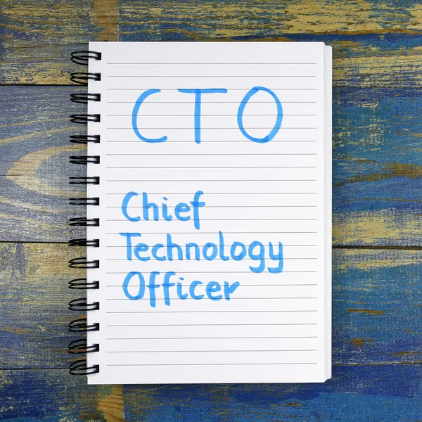 CTO- Chief Technology Officer text written in notebook on wooden background — Stock Photo, Image
