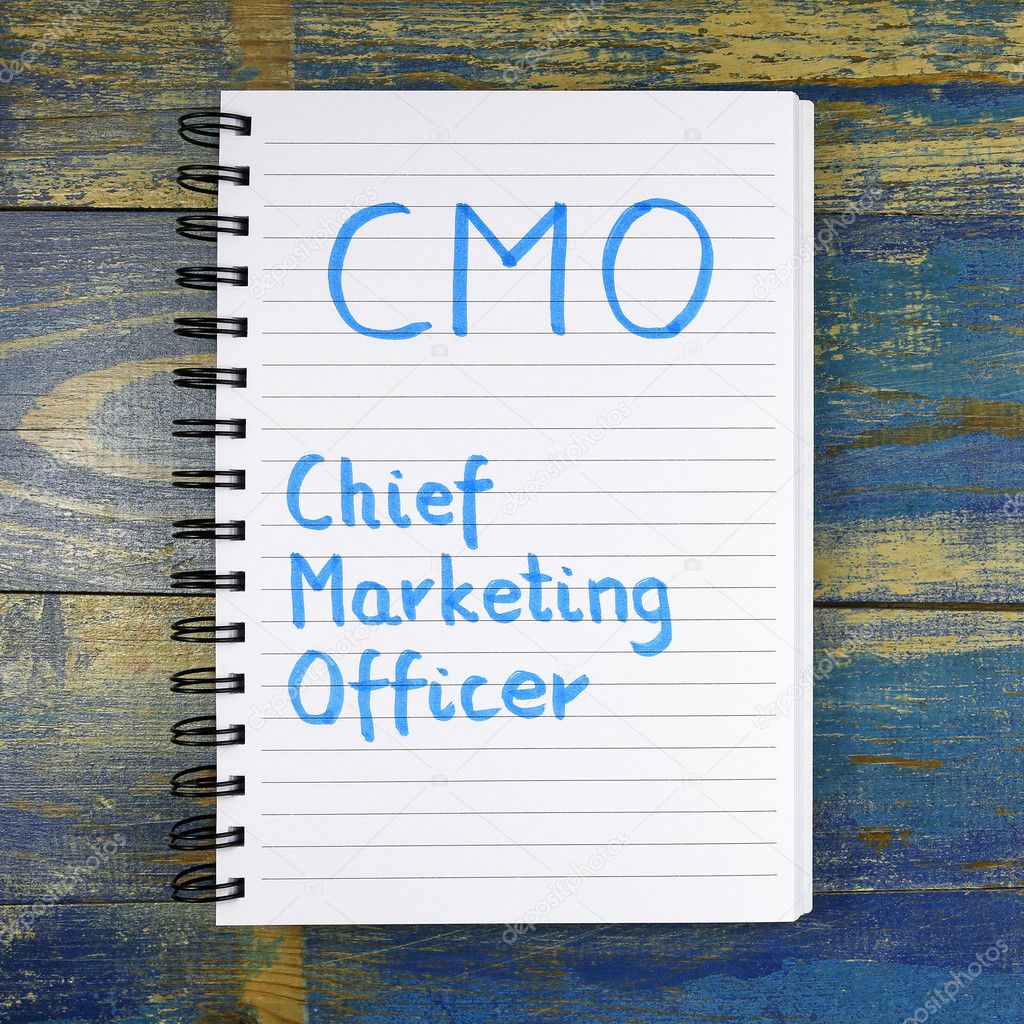 CMO- Chief Marketing Officer text written in notebook on wooden background