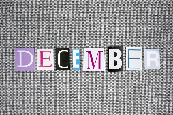 December word op grijze achtergrond — Stockfoto