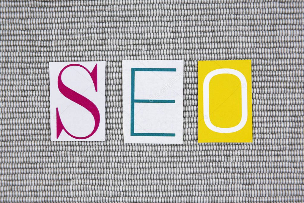 seo (Search Engine Optimization) acronym on grey background