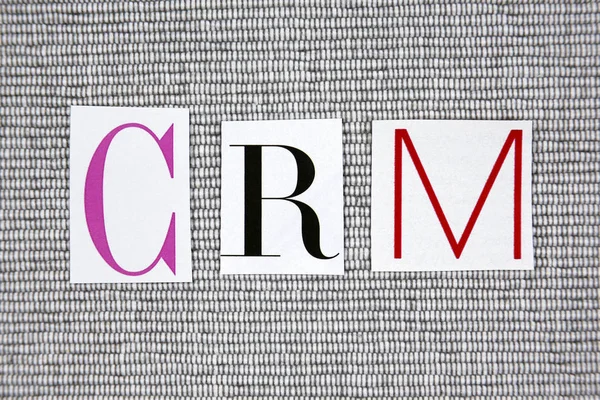 CRM (Customer Relationship Management) acrónimo sobre fondo gris —  Fotos de Stock