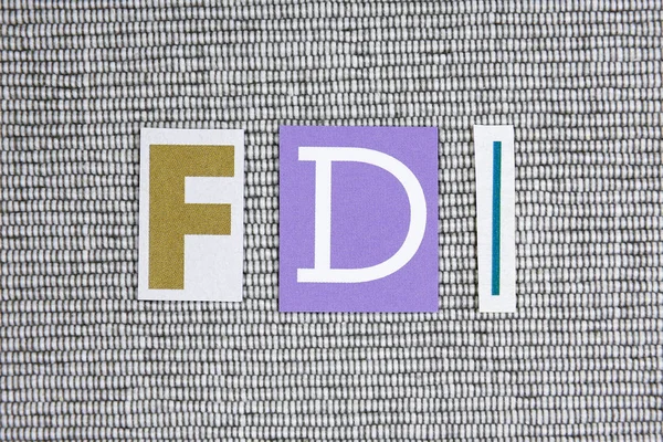 FDI (Foreign Direct Investment) acronym on grey background