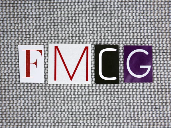 FMCG (Fast Moving Consumer Goods) acronimo su sfondo grigio — Foto Stock