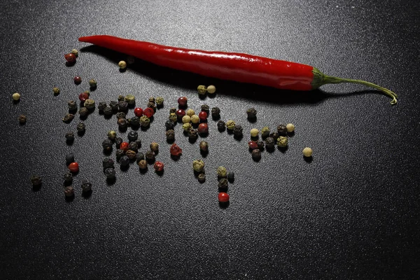 Red chili pepper on black background — Stock Photo, Image