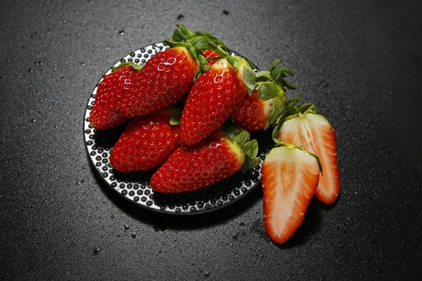 Fresh strawberries on black background — Stock Photo, Image