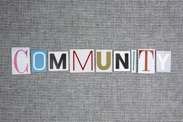Slovo Společenství na šedém pozadí — Stock fotografie