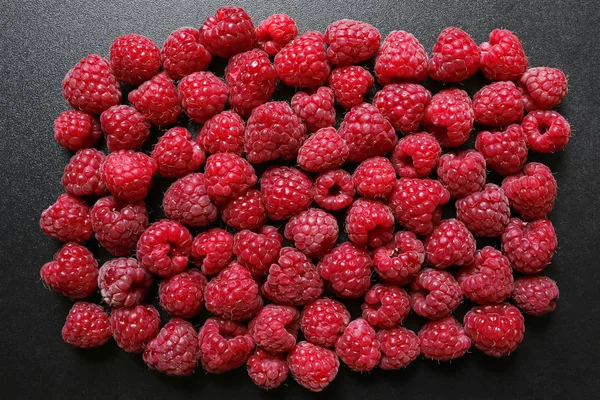 Fresh raspberries on black background — Stock Photo, Image