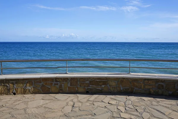 Empty sea promenade, stone wall — Stock Photo, Image