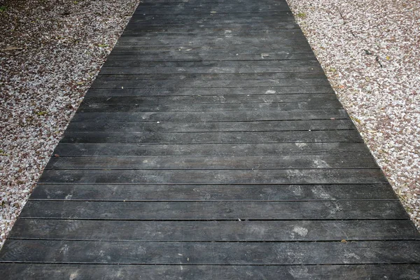 Wooden path among the pebbles — Stock Photo, Image