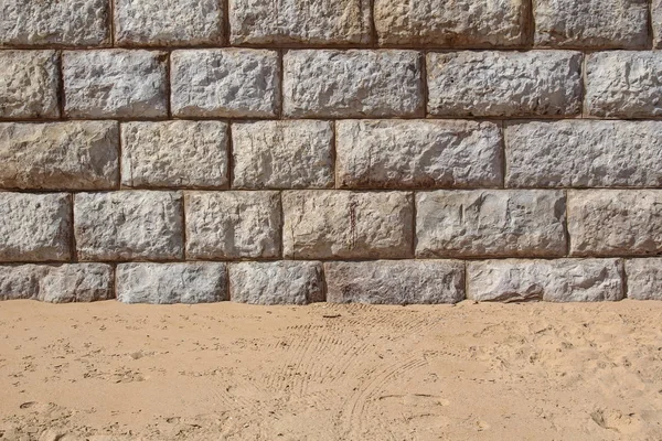 Stone wall and sand background — Stock Photo, Image