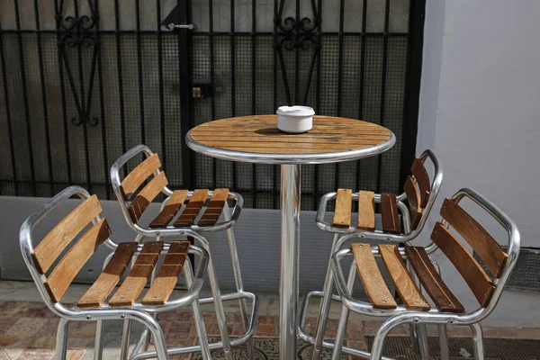 Empty chairs in a street cafe — Stock Photo, Image
