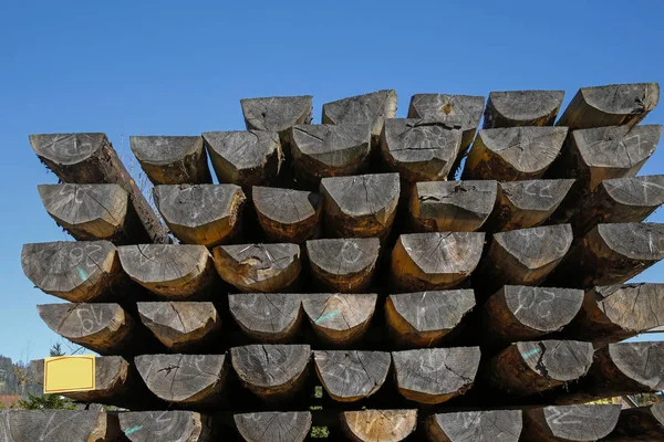 heap of construction wooden logs for house building