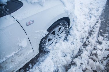 Car fully covered with thick snow, side view, winter concept. - Image clipart
