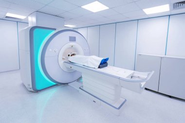 Female patient undergoing MRI - Magnetic resonance imaging in Hospital. Medical Equipment and Health Care clipart