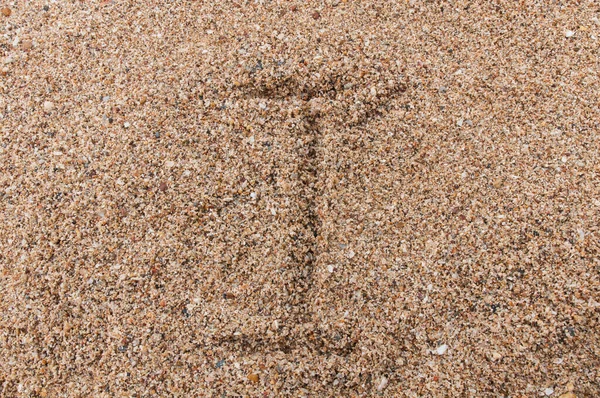 Персонаж I алфавіту, що пишеться на піску — стокове фото
