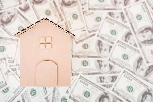 House cardboard model on dollar money — Stock Photo, Image