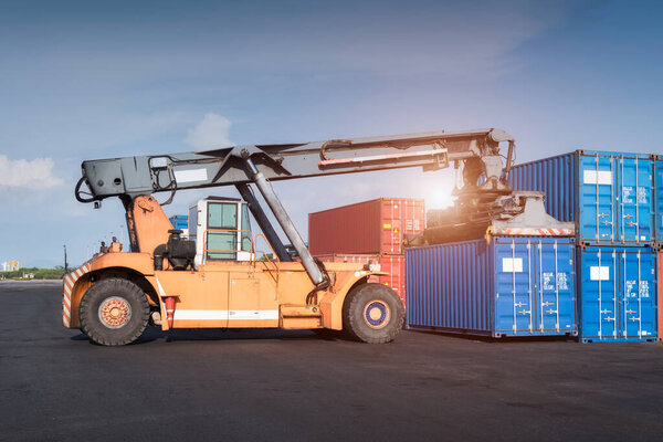 Forklift truck lifting Cargo containers in shipping