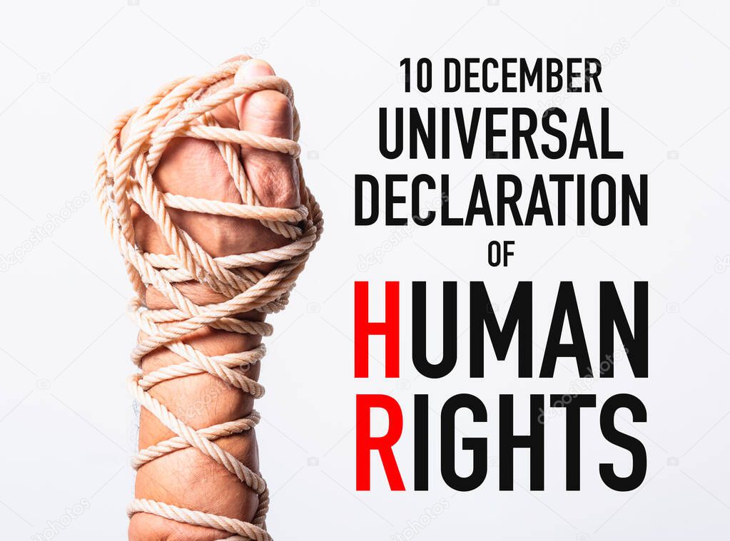 Rope on fist hand with 10 december universal declaration of HUMA