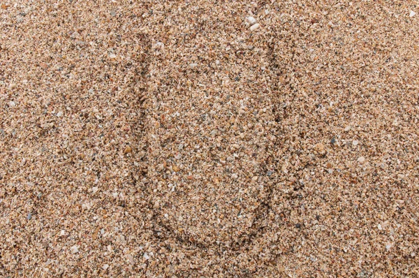 砂の上に書かれたアルファベットの文字U — ストック写真
