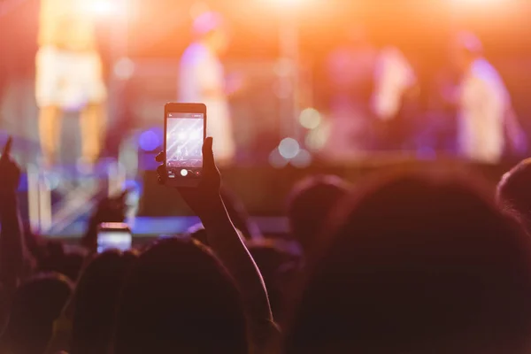 Event people live video festival music concert by hand holding smart mobile phone