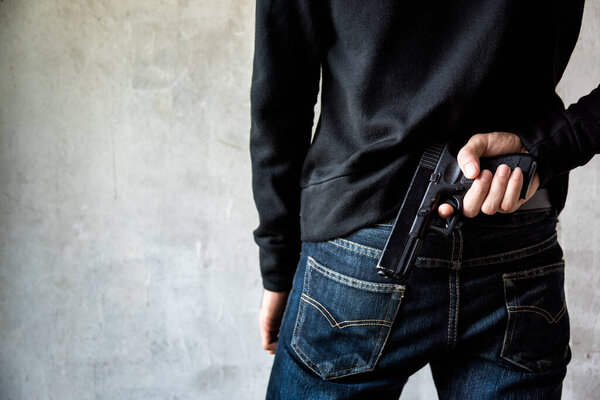 Man hid gun behind their back, robbery, crime, kidnapping