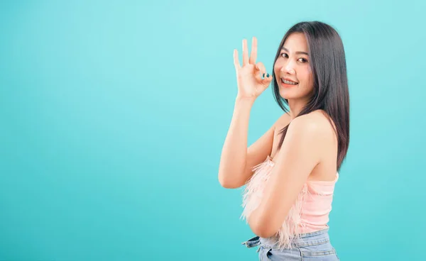 Portrait asian beautiful woman smiling showing finger OK sign an — ストック写真