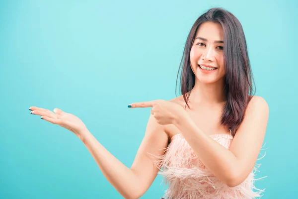 Smiling face Asian beautiful woman her point finger beside and l — ストック写真