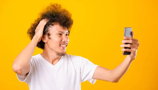 Portrait asian handsome man curly hair taking selfie with mobile — ストック写真