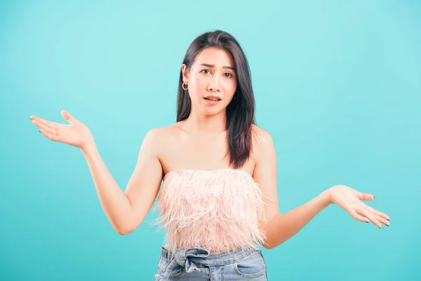 Asian Beautiful Woman Her Confused Throwing Hands Aside Blue Background — ストック写真