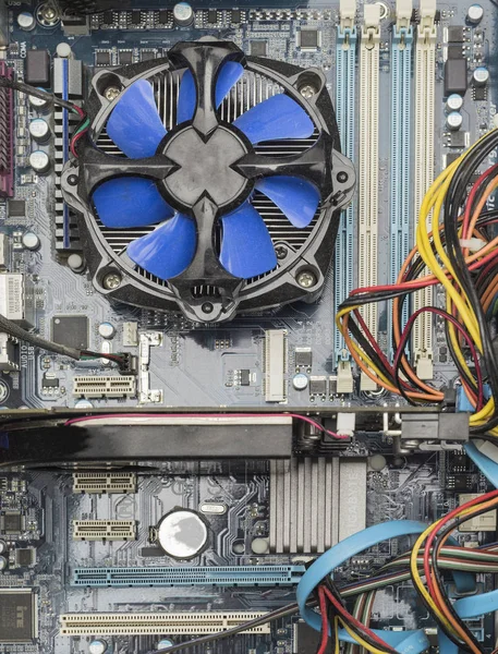 top view of blue cpu fan and Video Card on motherboard.