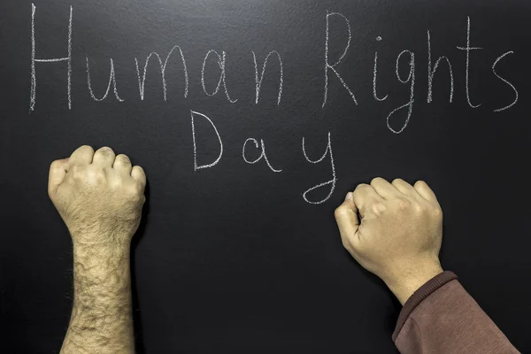 Tekst napisany: dzień praw człowieka z dwie pięści. — Zdjęcie stockowe