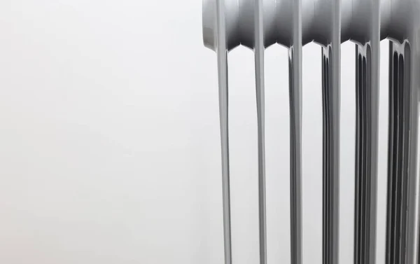 Oil electric radiator heater on white background.