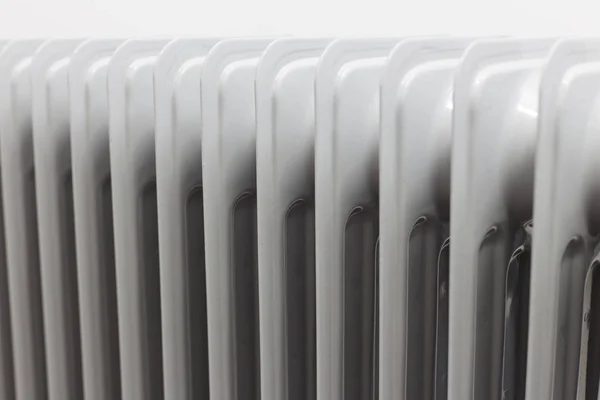 View from right horizontal at oil electric radiator heater on white background. — Stock Photo, Image