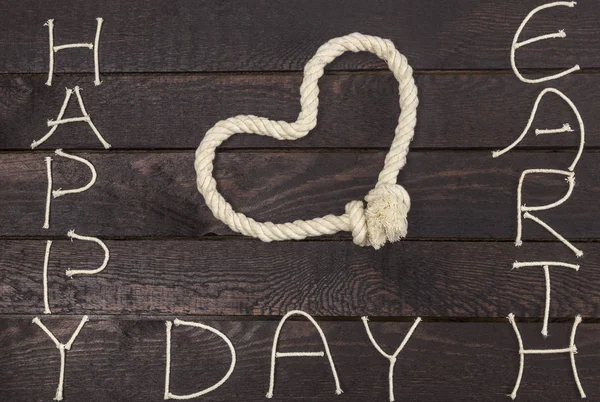 Touw in de vorm van liefde hart met tekst: Happy dag van de aarde — Stockfoto