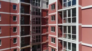 Construction site with a bird's eye in a megacity. New house in a new residential complex. Flying over the construction site. aerial panoramic top view from hight copter drone flying sky footage