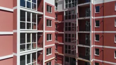 Construction site with a bird's eye in a megacity. New house in a new residential complex. Flying over the construction site. aerial panoramic top view from hight copter drone flying sky footage
