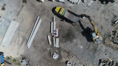 Construction site with a bird's eye in a megacity. New house in a new residential complex. Flying over the construction site. aerial panoramic top view from hight copter drone flying sky footage