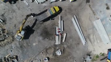 Construction site with a bird's eye in a megacity. New house in a new residential complex. Flying over the construction site. aerial panoramic top view from hight copter drone flying sky footage