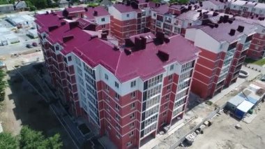 Construction site with a bird's eye in a megacity. New house in a new residential complex. Flying over the construction site. aerial panoramic top view from hight copter drone flying sky footage