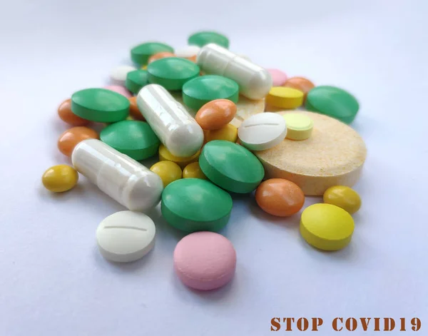 Colorful pills, medicine background. Tablets prescribed for different diseases, health care background, colored pills. Medical conceptual photo background. Stop COVID19 concept