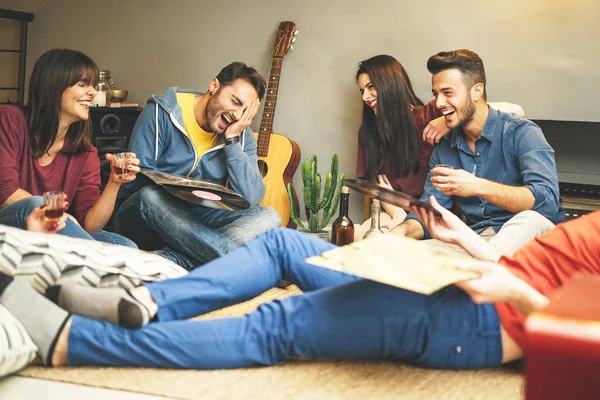 Happy Young Friends Having Fun Home Listening Vintage Vinyl Disc Stock Photo