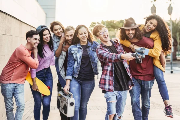 Happy young friends filming video with gimbal mobile smartphone outdoor - Millennial trendy people having fun with new technology social media apps - Youth generation people lifestyle concept — Stock Photo, Image