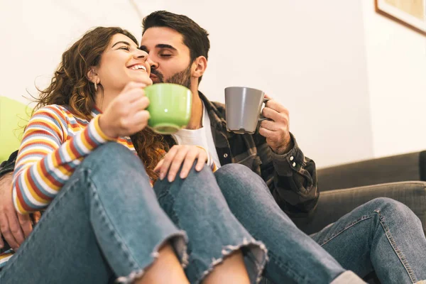 Young Couple Drinking Coffee Cup Sitting Floor Next Sofa Happy — Stock Photo, Image