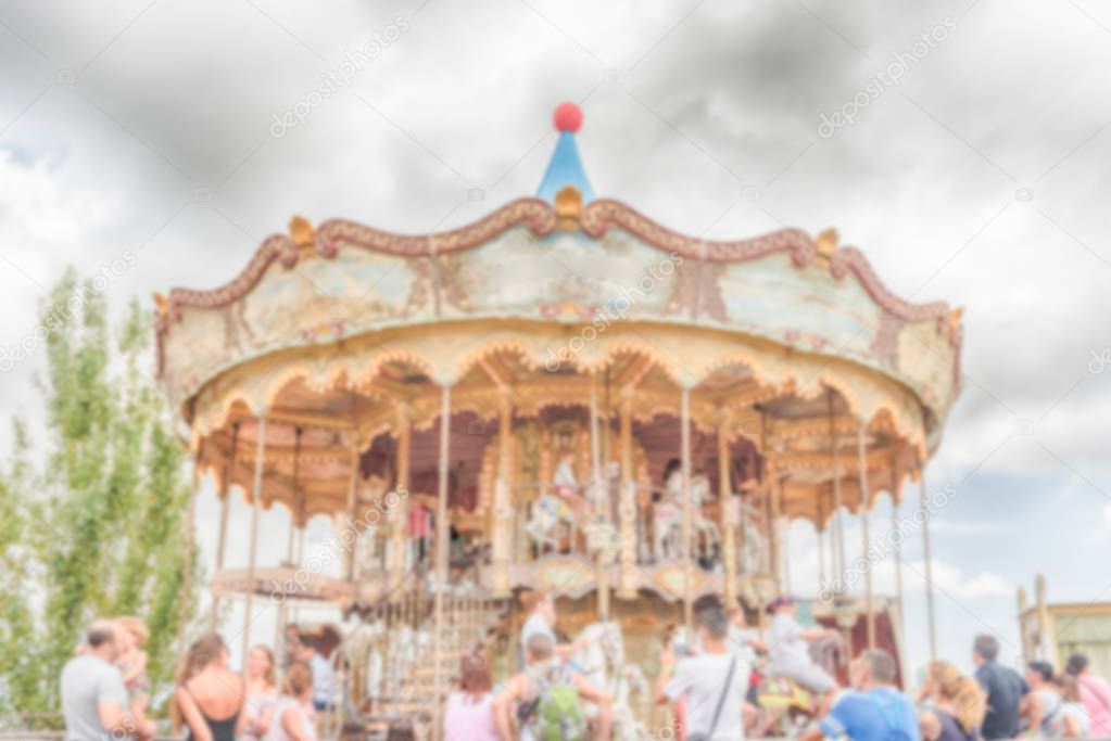 Defocused background of old vintage carousel at in amusement park
