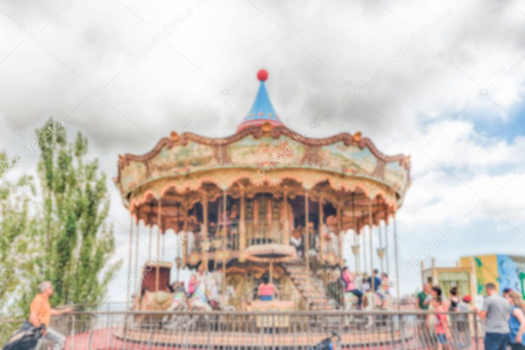 Defocused background of old vintage carousel at in amusement park
