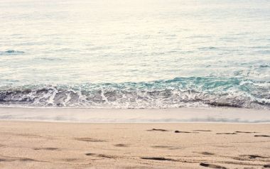 Beautiful summer season specific photograph. Calm beach/shore waves. Rich blue/turquoise marine/ocean colors. Lovely lights and summer colors. Marine and ocean environment in summer. Slow moving waves clipart