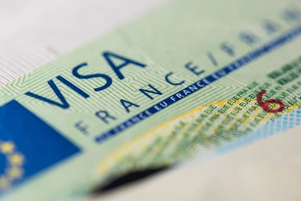 Schengen visa in the passport. This sample of the Schengen visa has been put into circulation since 2019. Selective focus. — Stockfoto