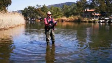 Hisaronu Orhaniye, Marmaris - Mugla / Türkiye. Hisaronu 'da nehirde bir balıkçı..