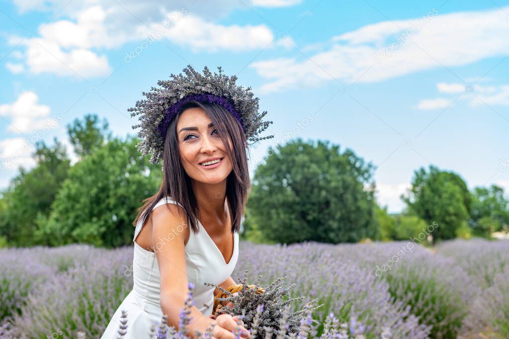 Turkey's lavender paradise: Kuyucak Village, Isparta - Turkey . Beautiful woman in the lavander field of the Kuyucak Isparta. Woman model is walking through lavender fields. 